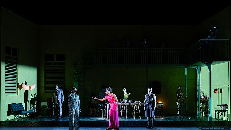 Scene: Alcina. The sorceress Alcina stands in the center of the stage; the set is a simple apartment.