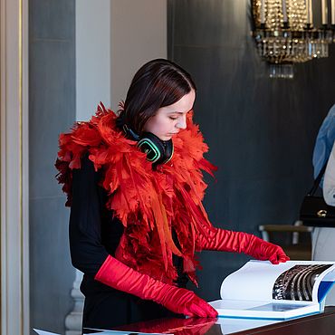 DJ with a red feather boa