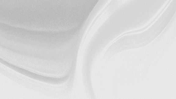 Abstract light background: softly flowing pale grey fabric with gentle folds and a fine grain.