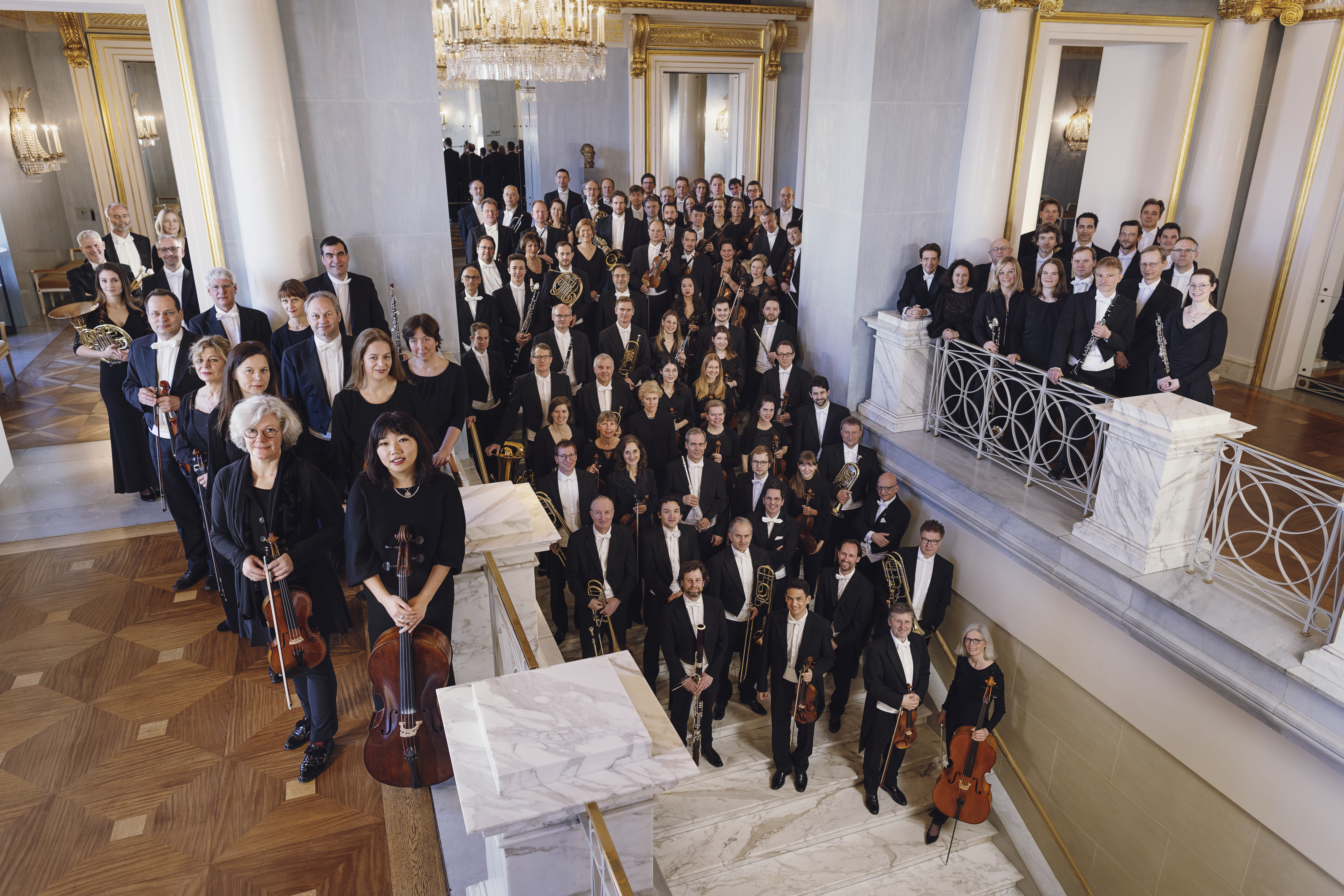 Musicians from the Bayerische Staatsorchester on a staircase at the Nationaltheater